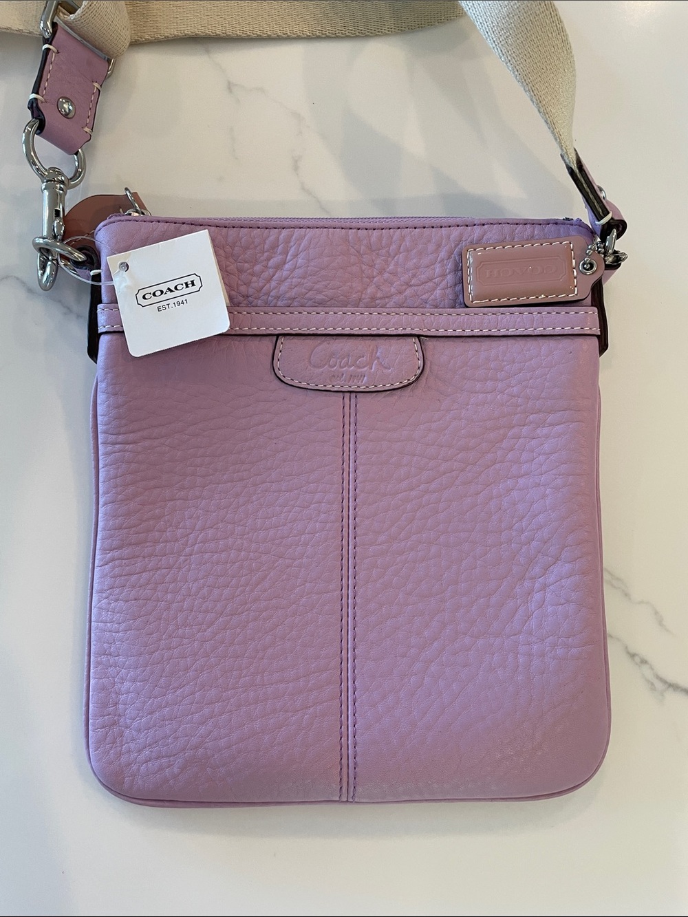 NWT Authentic Coach pebbled swing pack.  Lovely lilac.